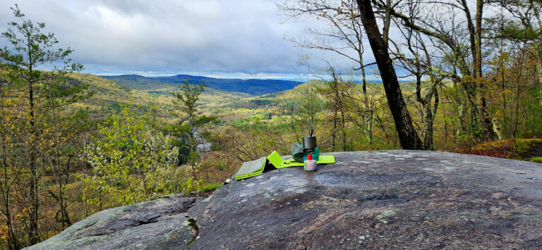 Trail breakfast on top of a rock overlooking the woods.